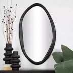 Miroir mural ovale abstrait en bois noir